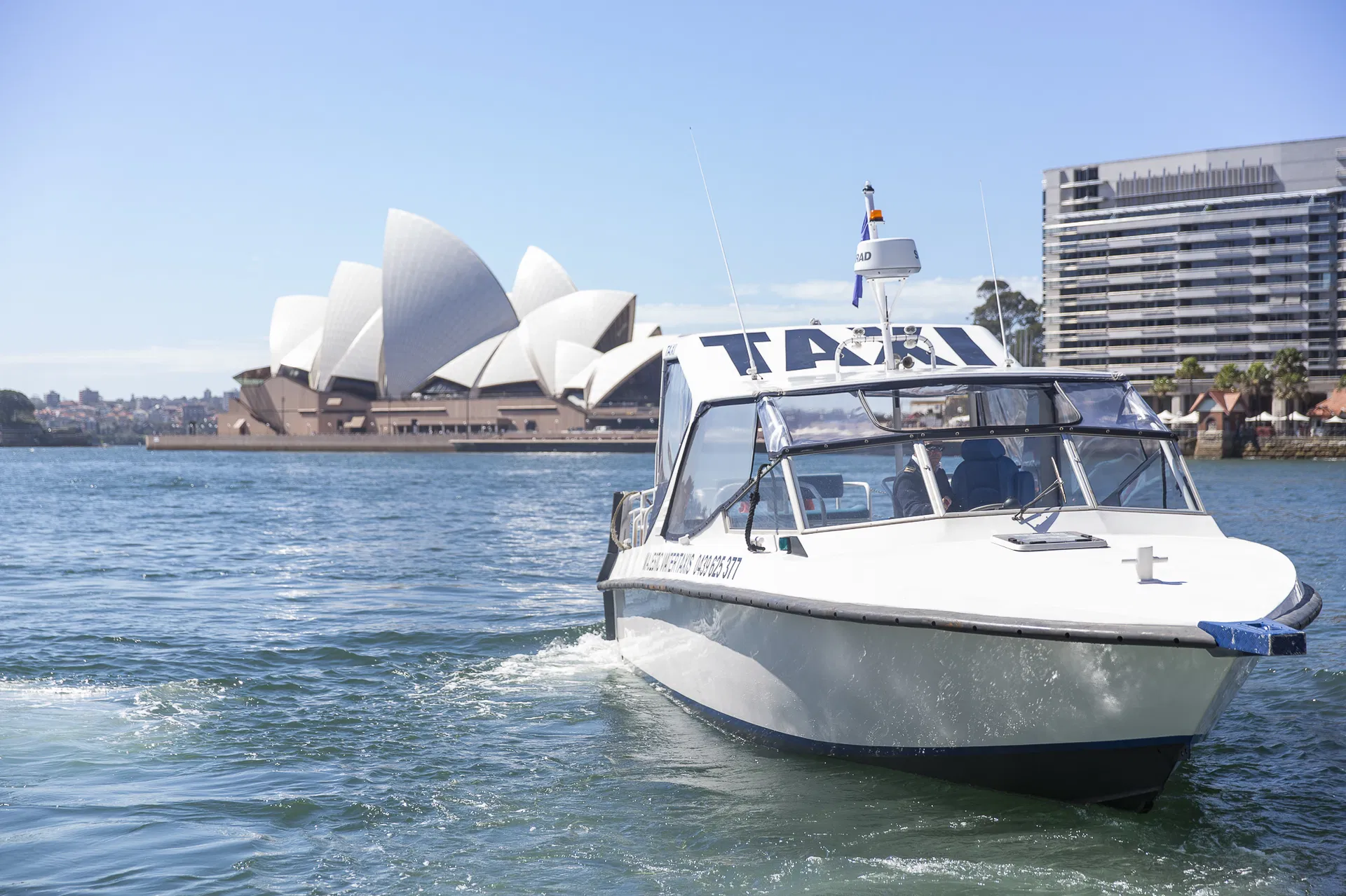 Majestic water taxi passing the Sydney Opera House